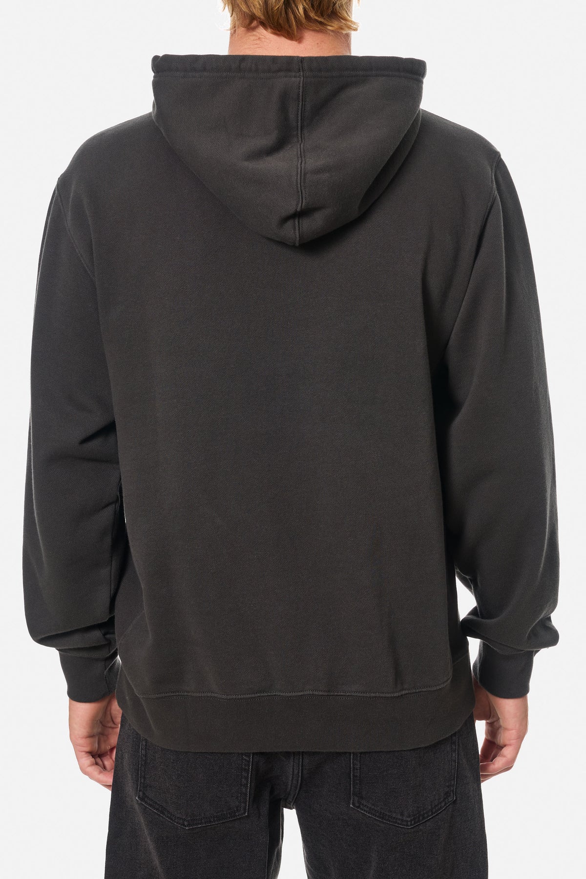 Back of a person wearing a black wash hoodie sweatshirt on a white background