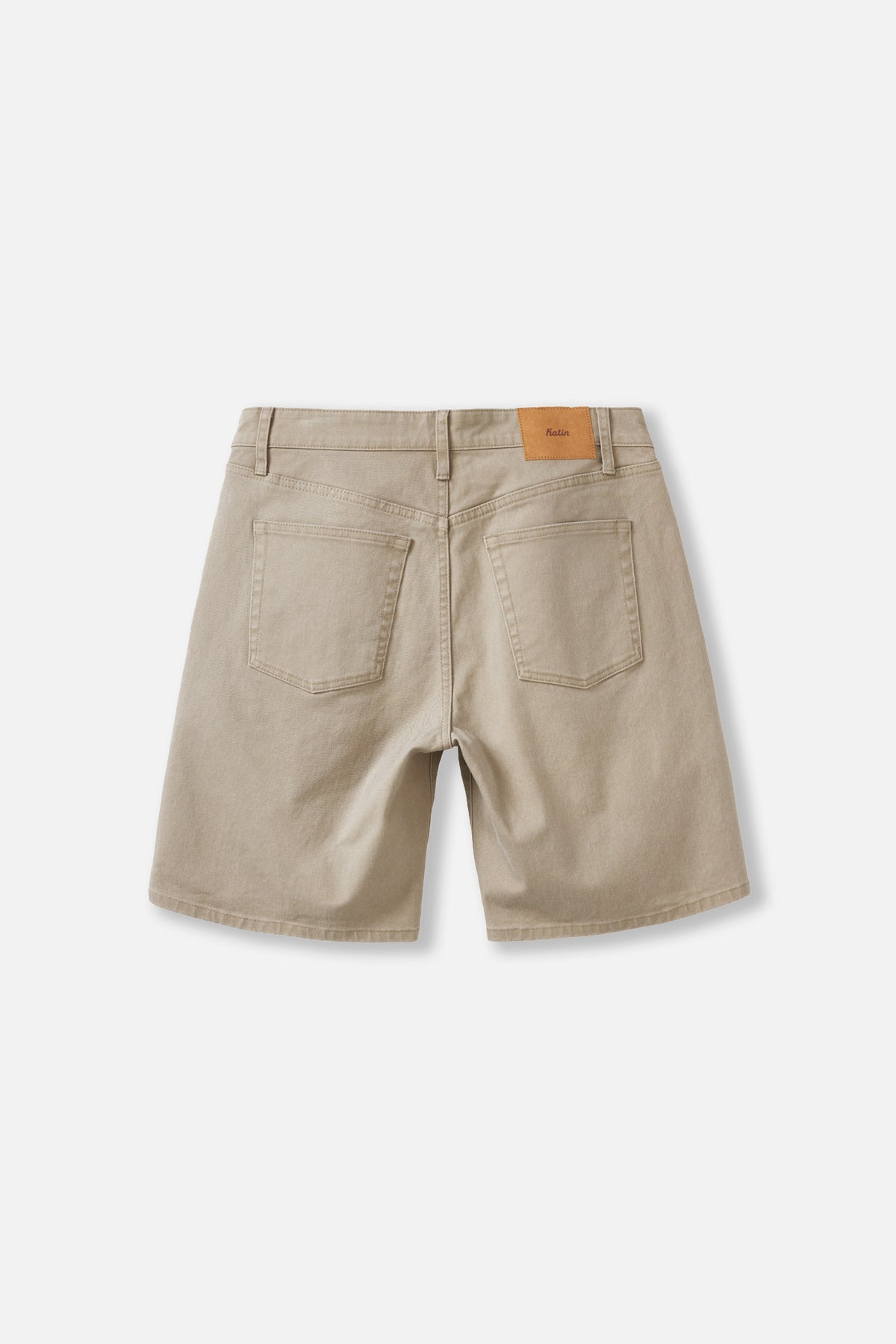 Tan denim shorts from the back angle on a white background