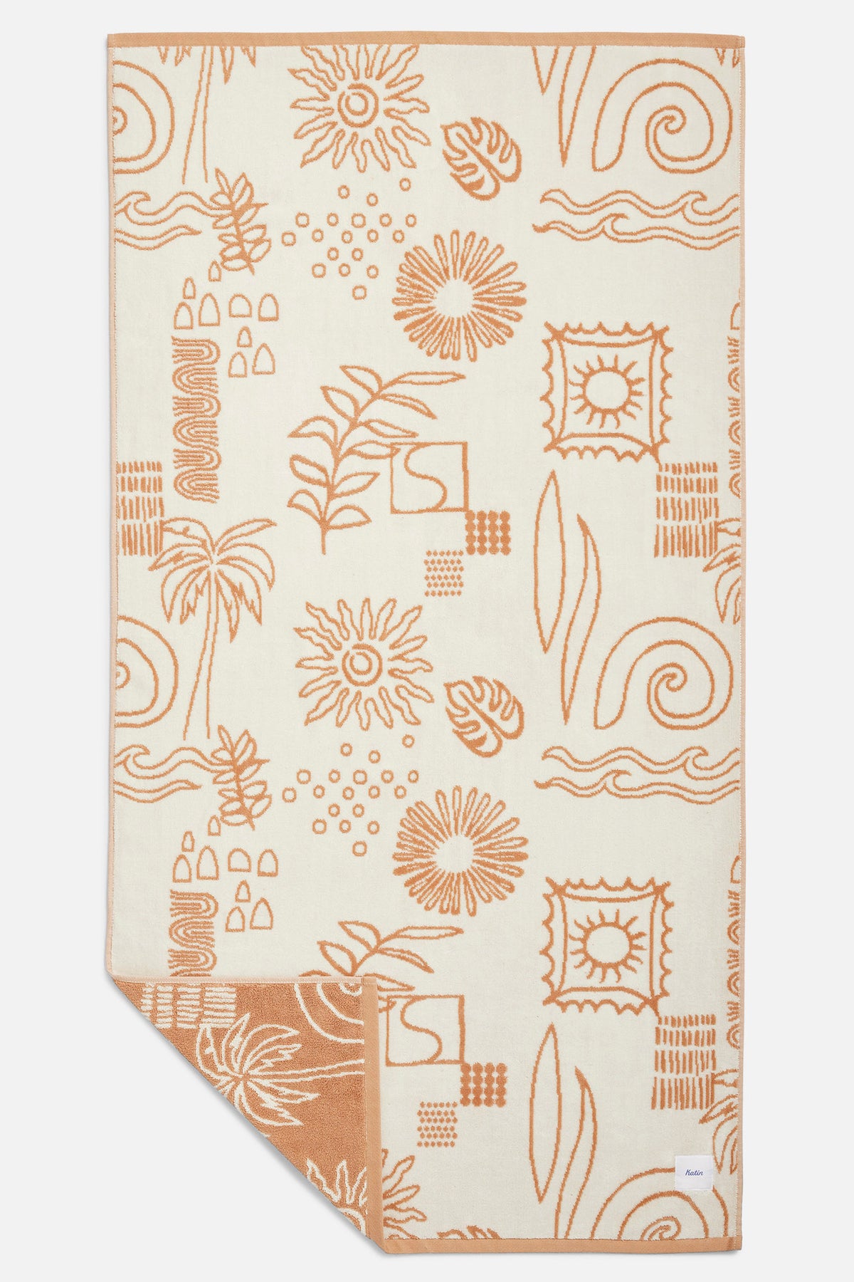 Beige towel with brown abstract patterns on a white background