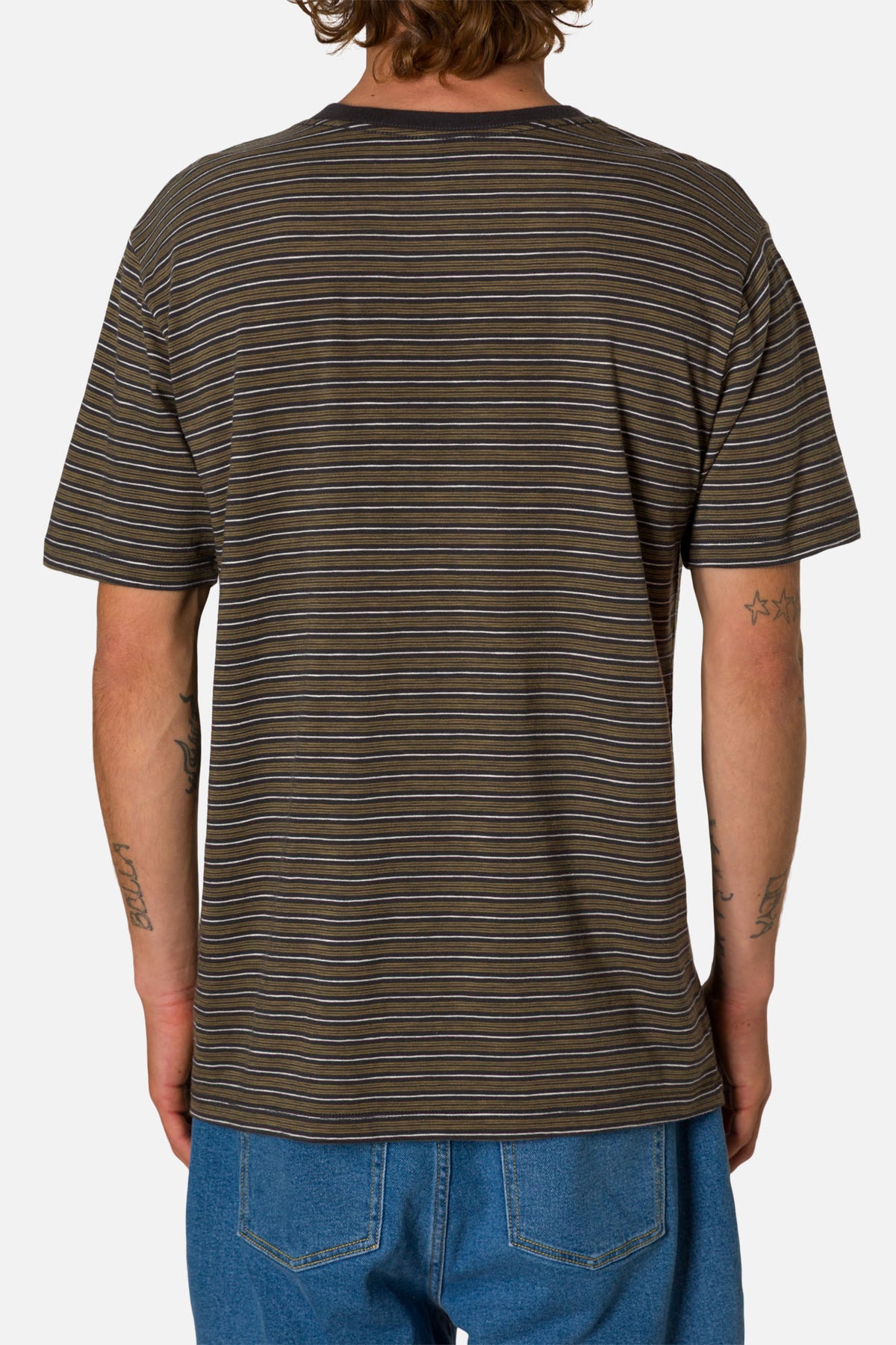 Person wearing a brown striped t-shirt and blue jeans on a white background