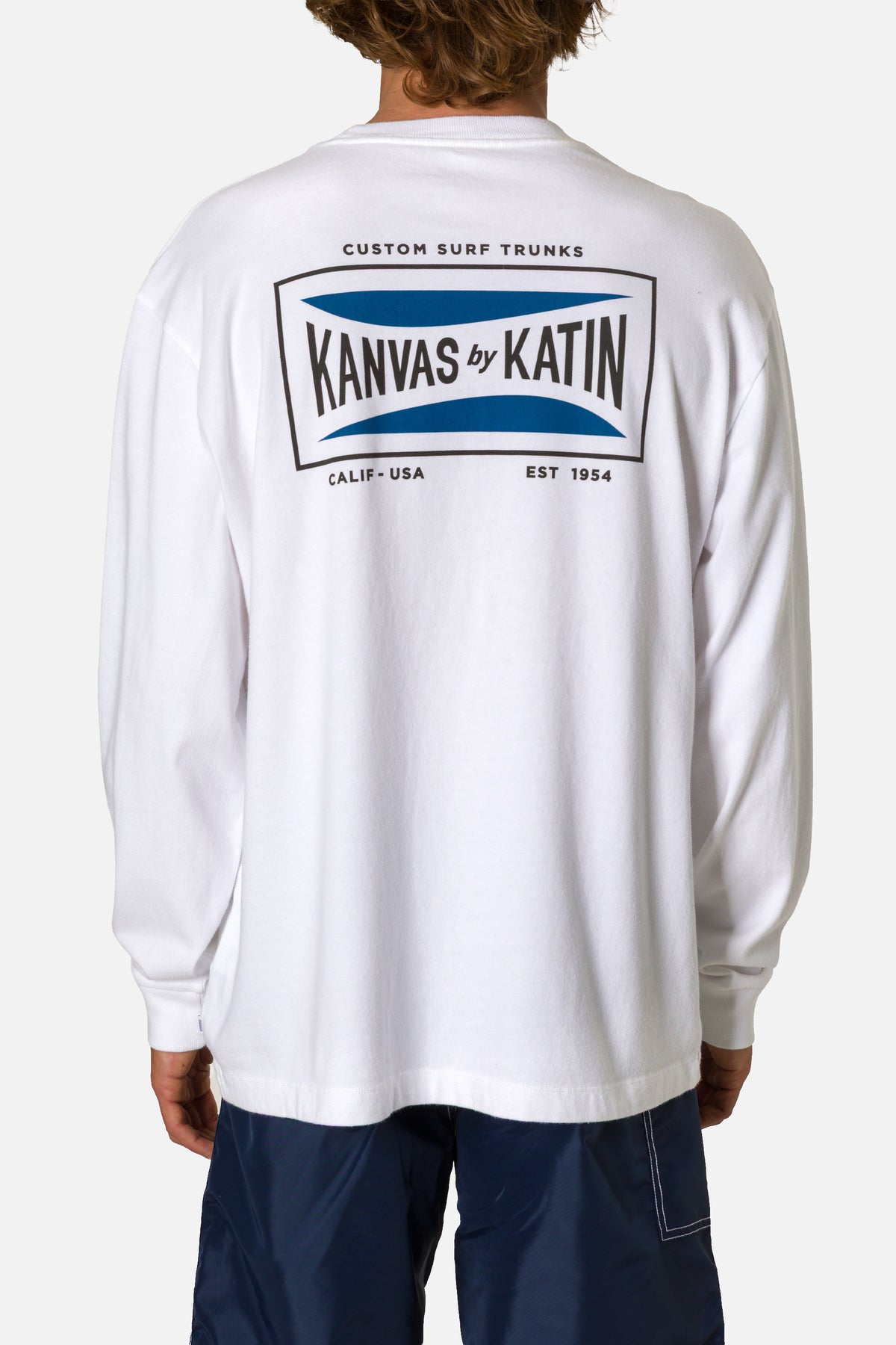 White long-sleeve shirt with Kanvas by Katin branding on the back, worn by a person.