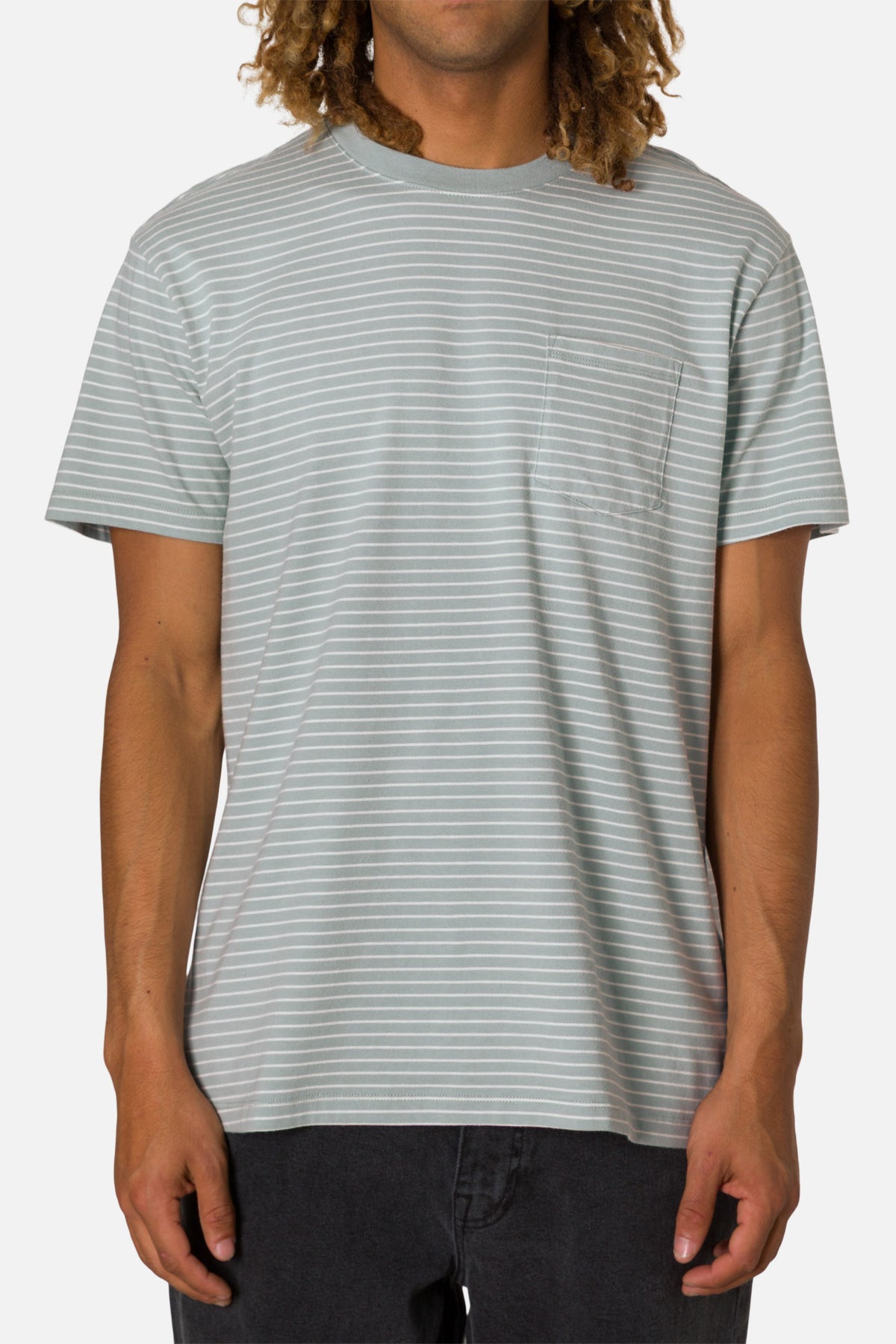 Man wearing a gray and white striped t-shirt on a plain background
