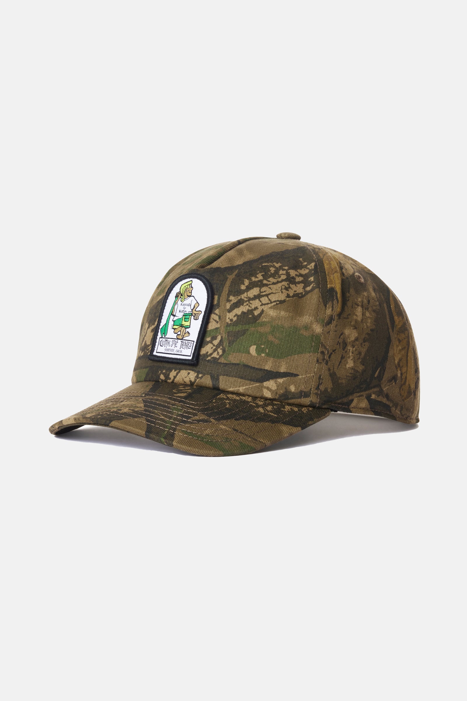 Camouflage cap with a patch on a light gray background