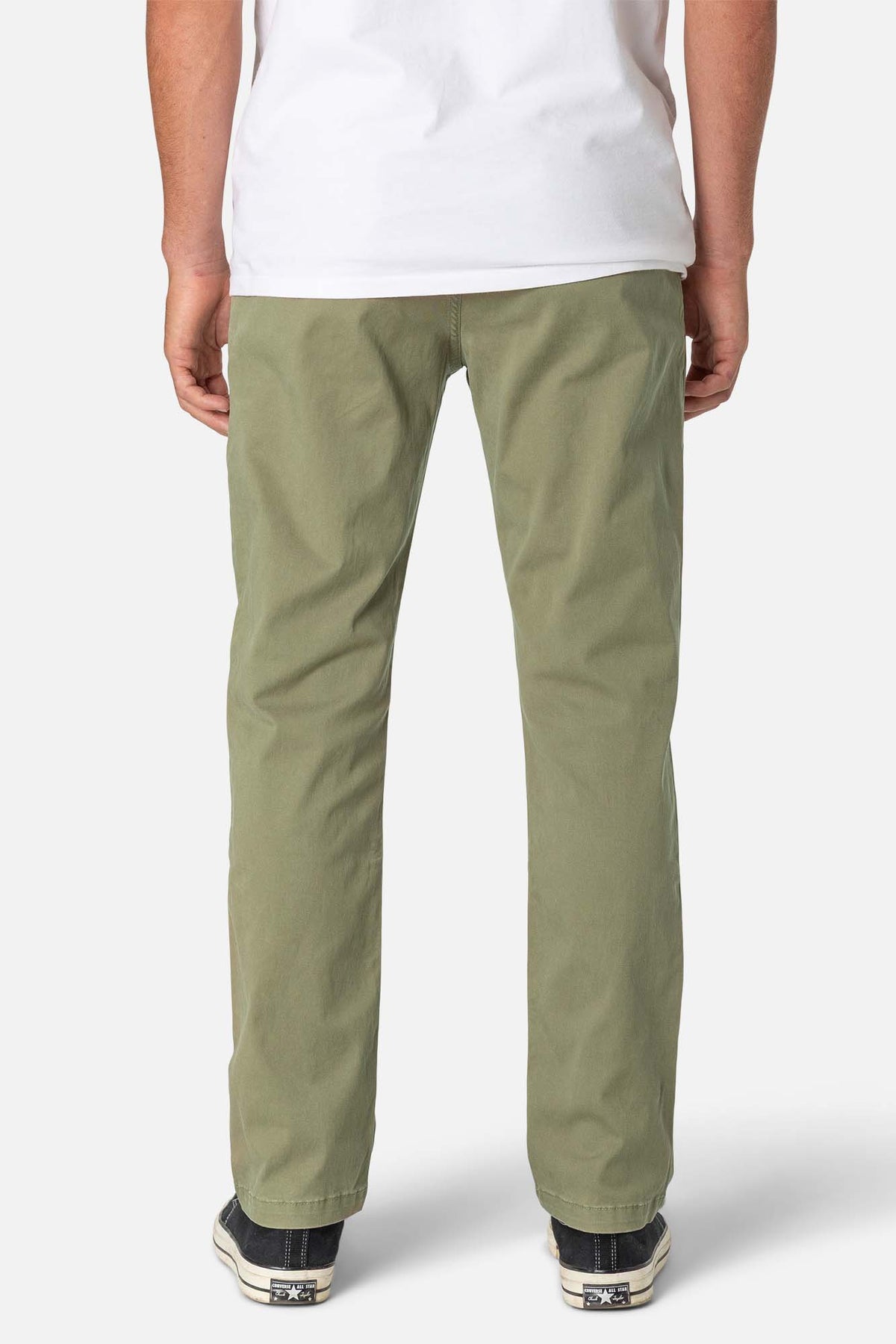 Person wearing olive green pants on a white background