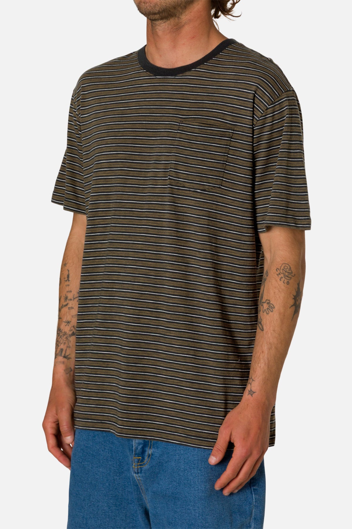 Man wearing a striped t-shirt and blue jeans on a white background
