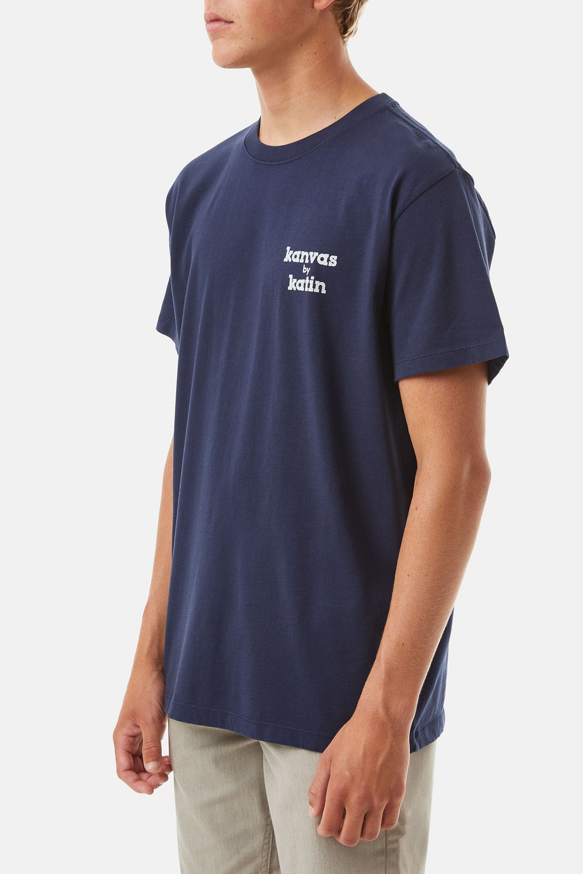 model wearing Polar navy shirt with White K-Man Graphic on a white background